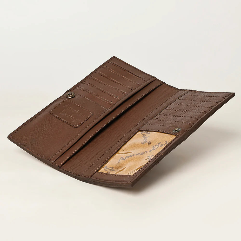 Brown leather wallet on a beige background