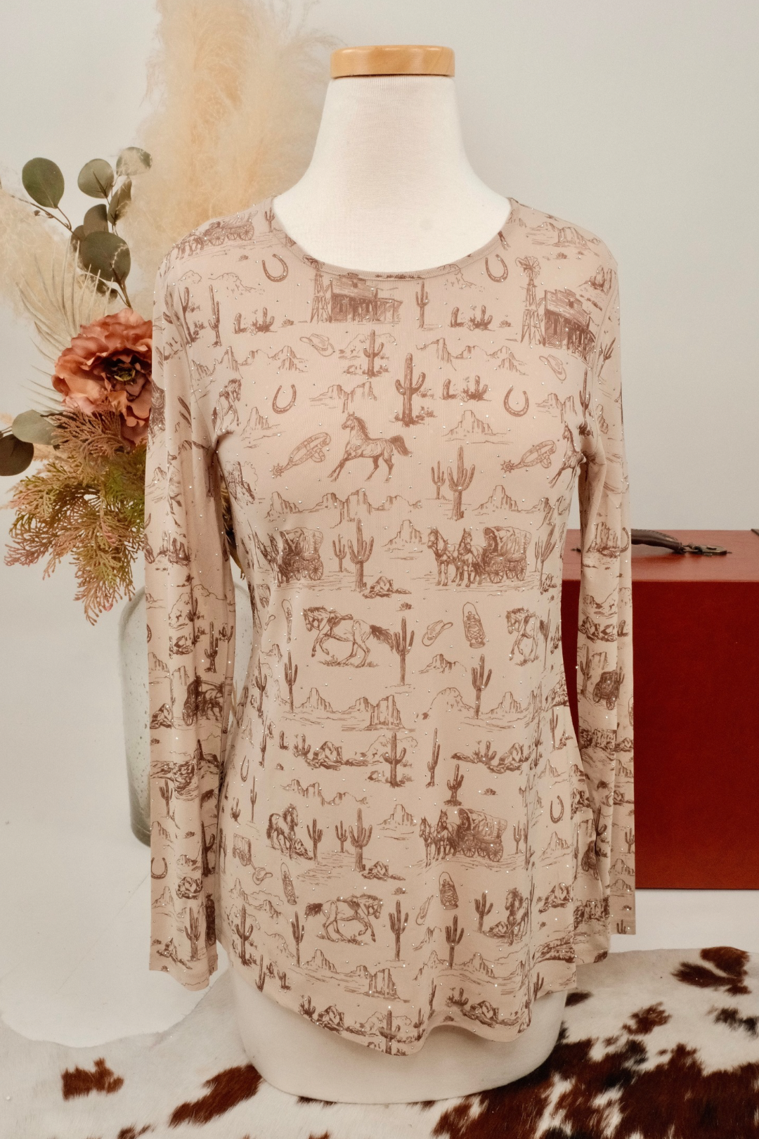 Long sleeve mesh with a western pattern on a mannequin against a neutral background