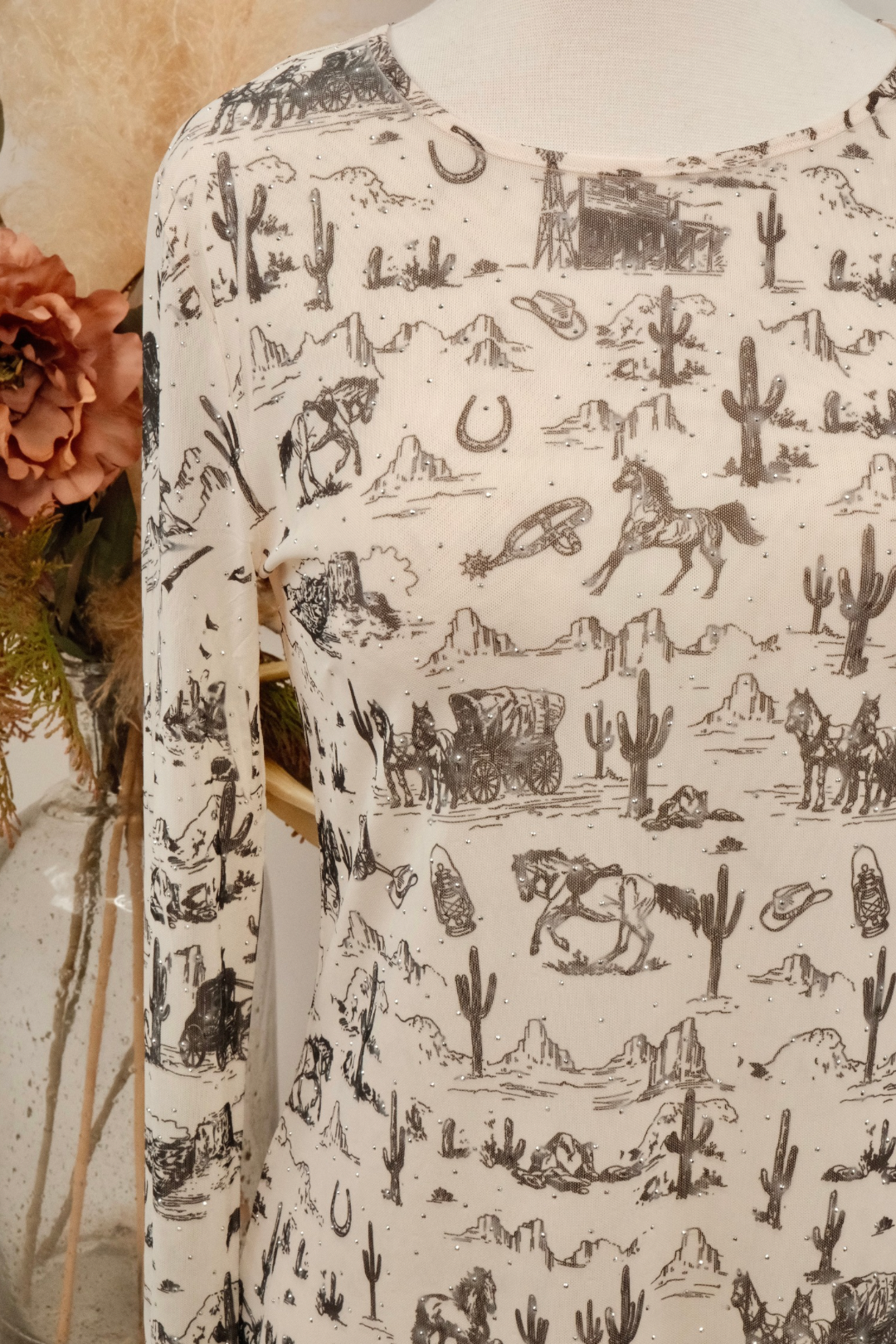 Long sleeve mesh top with a desert-themed pattern featuring cacti, horses, and landscapes.