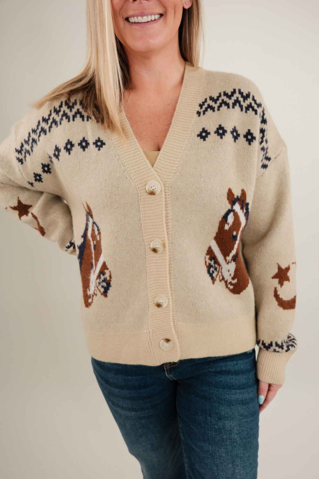Women’s Starlight Mustang Cardigan, beige knit western cardigan with galloping horse motifs and button-up cowgirl sweater style.