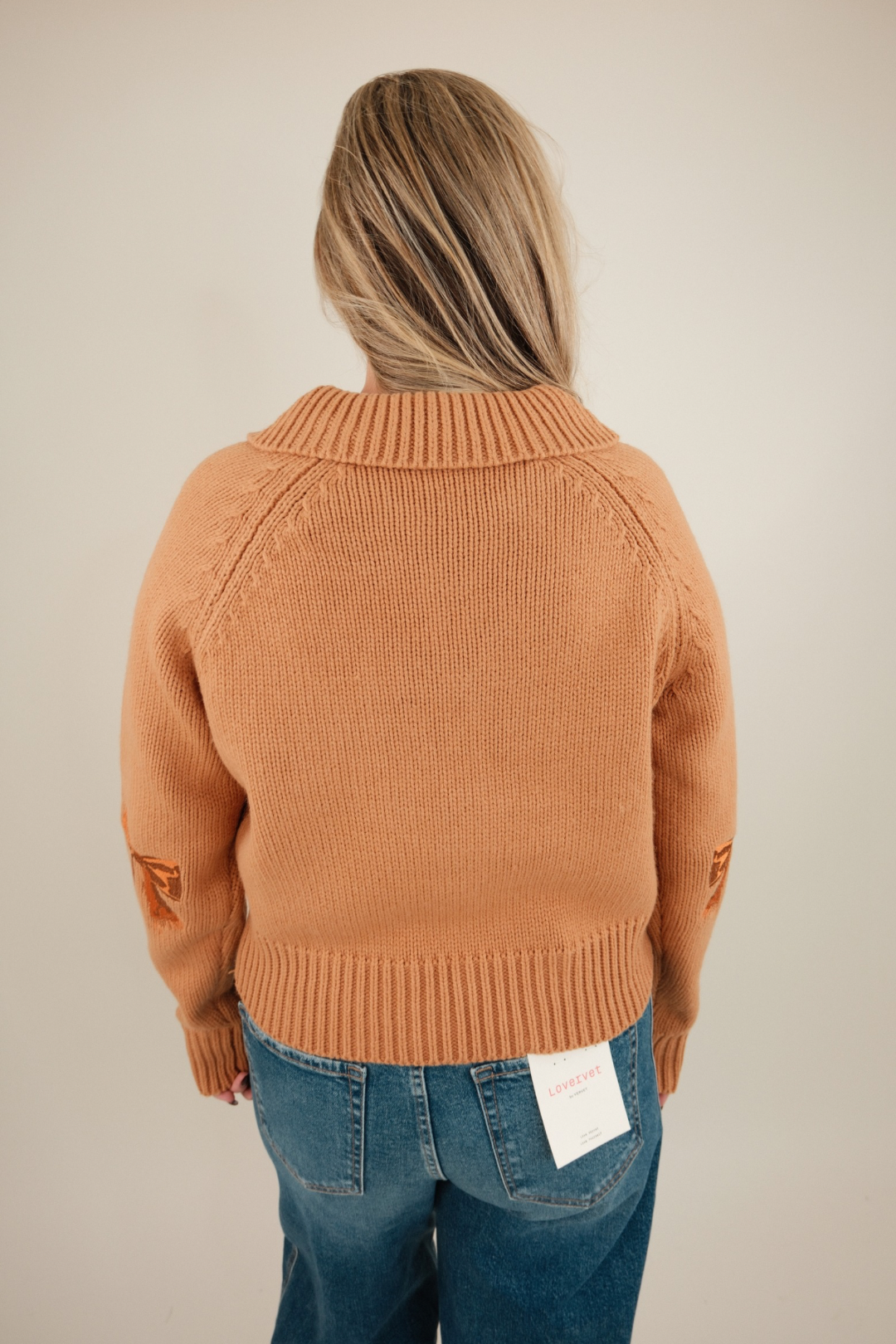 Back view of Sundance Embroidered Quarter-Zip Sweater with cozy western fit and bow accents on elbows for a feminine cowgirl touch.