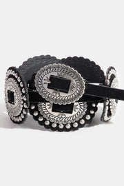 Black belt with silver concho design on a white background