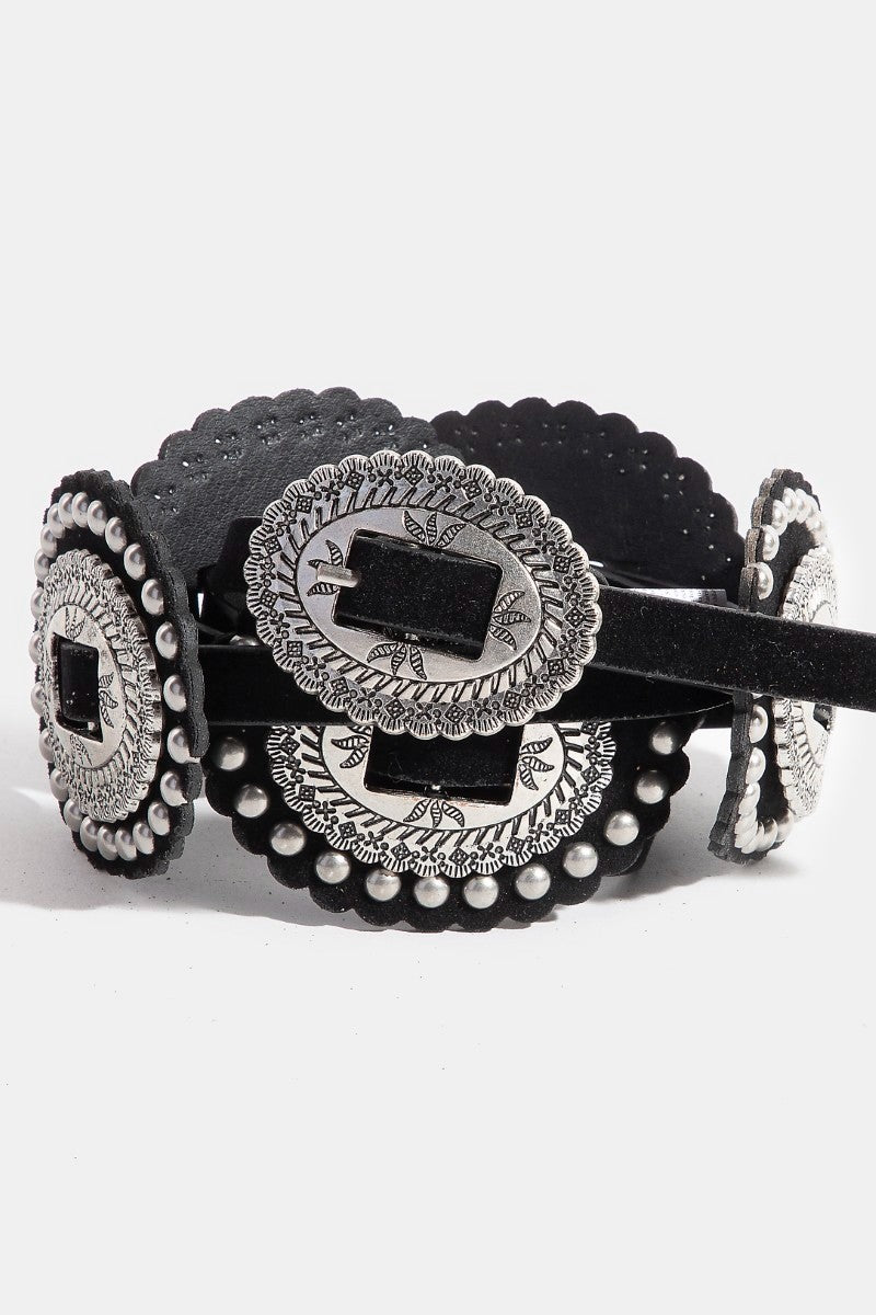 Black belt with silver concho design on a white background