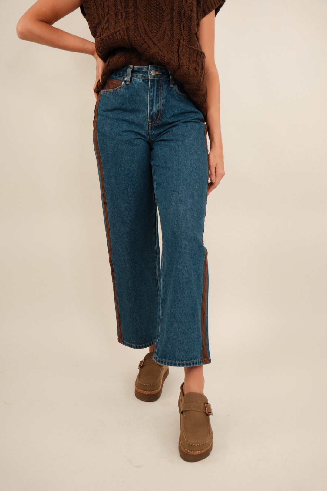 Mid-wash blue Sundance straight-leg denim jeans with five-pocket styling, clean front, and slight fading.