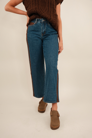 Mid-wash blue Sundance straight-leg denim jeans with five-pocket styling, clean front, and slight fading.