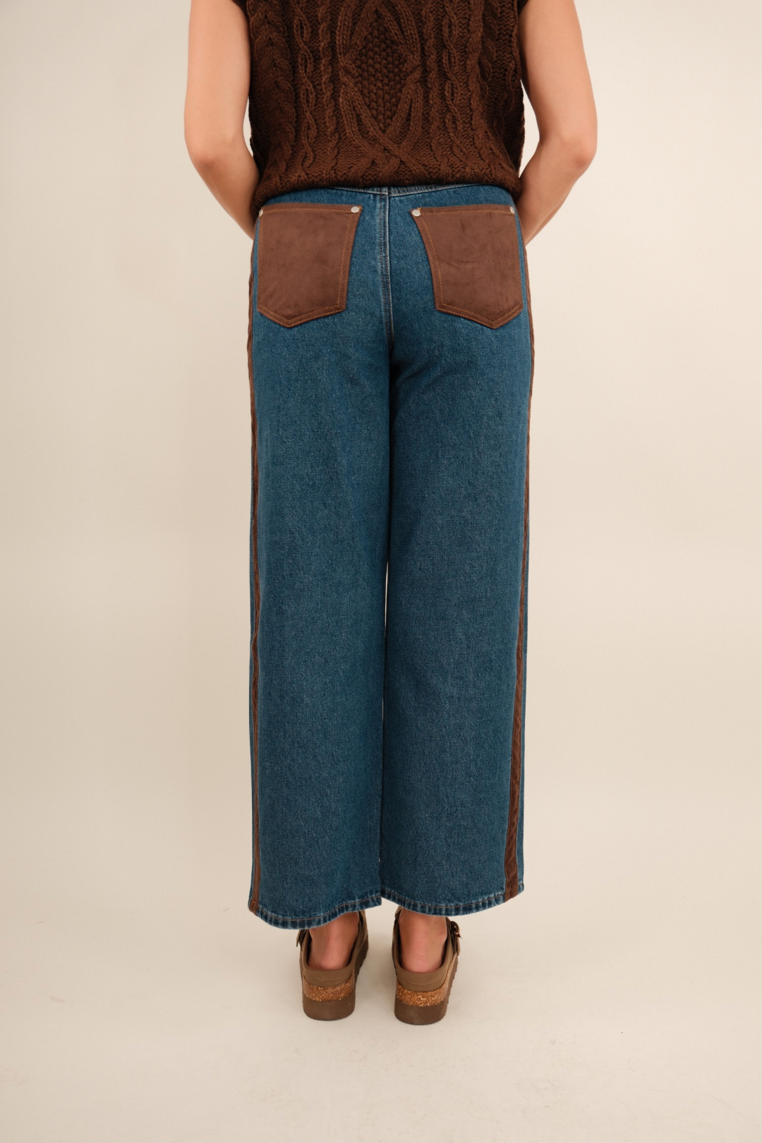 Back view of Sundance straight leg denim jeans with classic pockets and mid-rise waist.