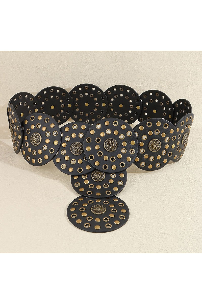 Black belt with gold circular patterns on a beige background