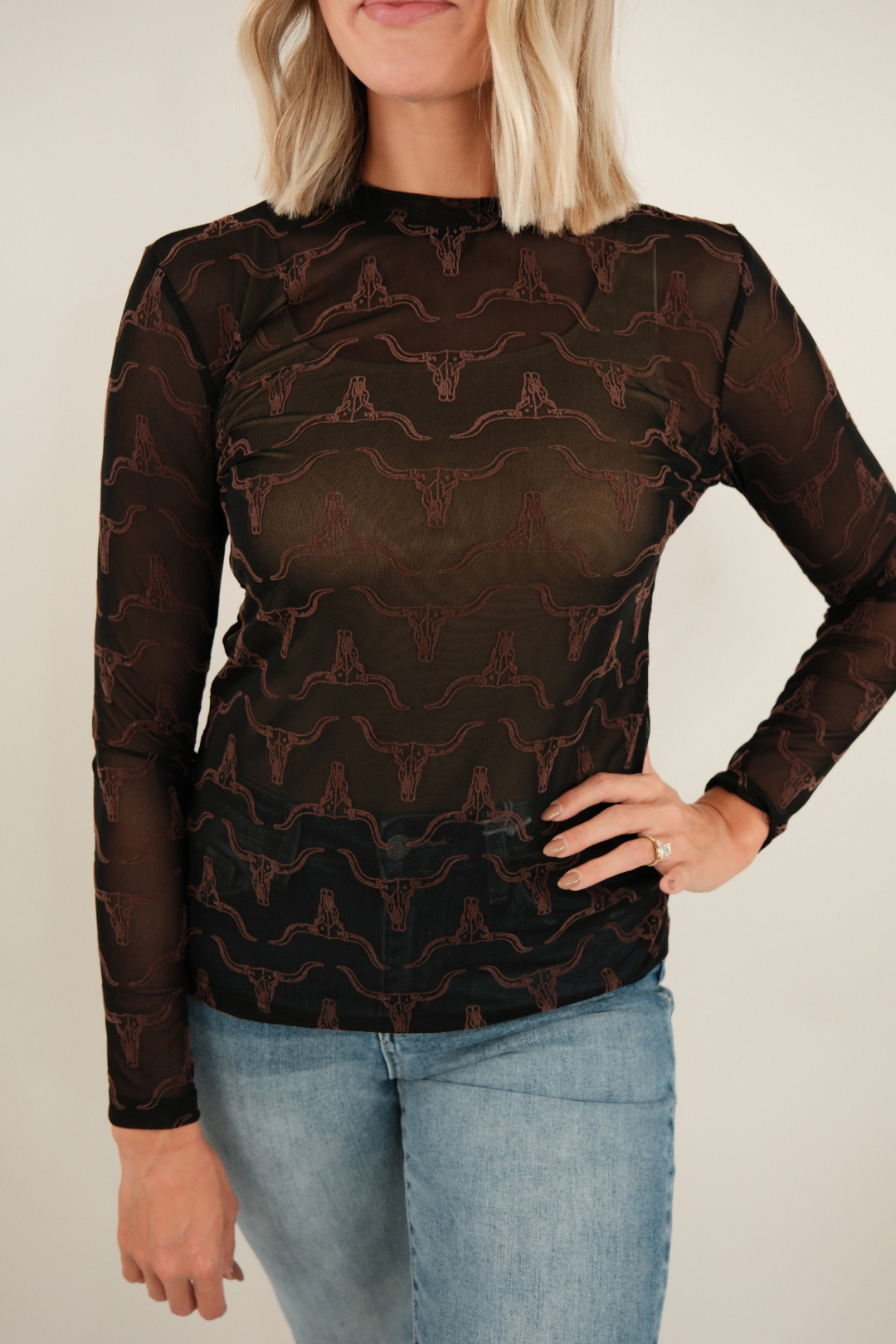Close-up of Velvet Longhorn Mesh Top highlighting women’s western style, sheer black mesh and brown velvet longhorn print.