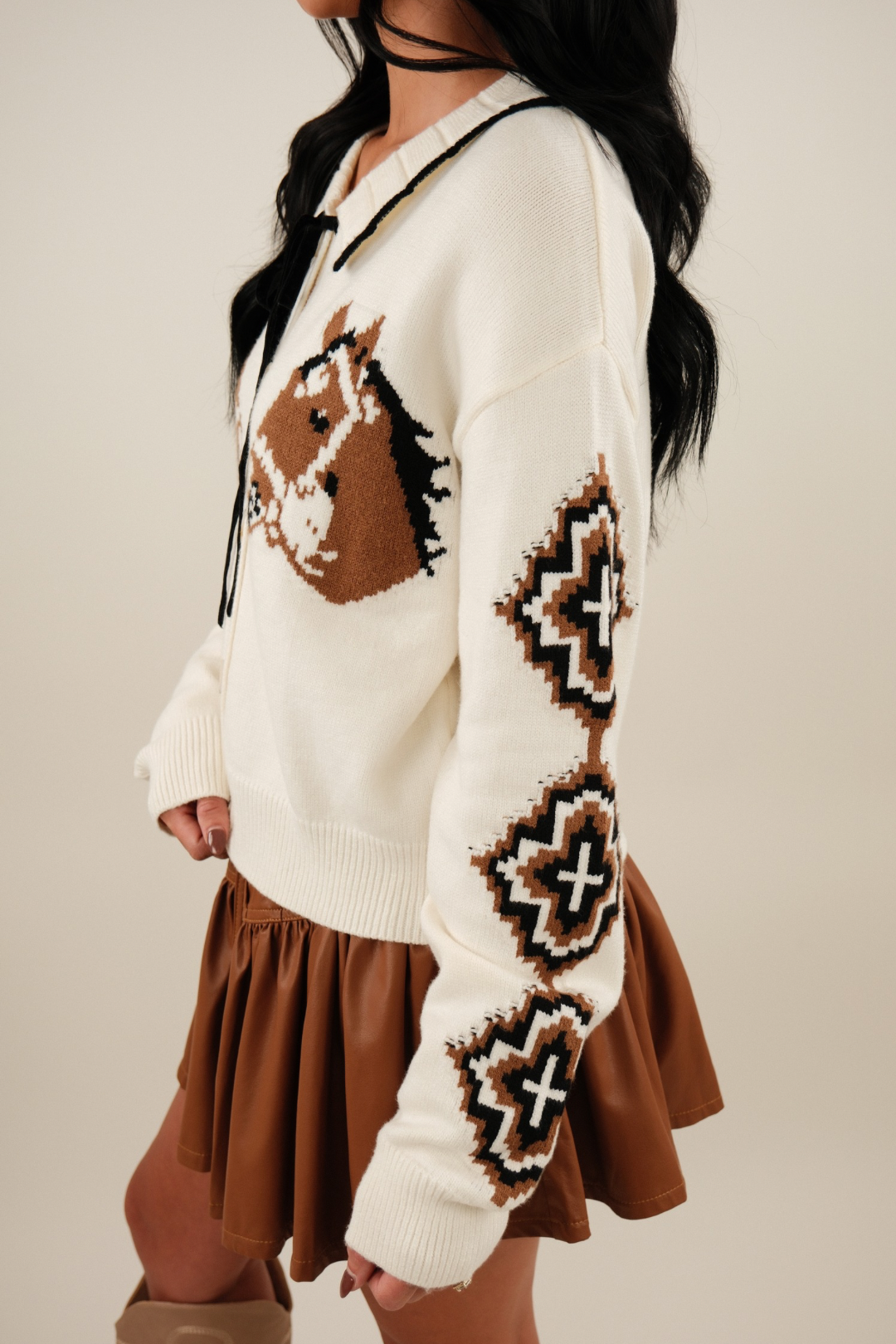 Side profile of Western Belle Cardigan in ivory with Aztec sleeve detail and relaxed fit.