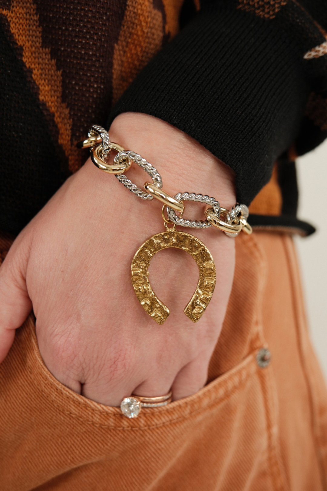 Western Luck Mixed Metal Link Bracelet highlighting rustic gold horseshoe charm and textured silver and gold interlocking links.