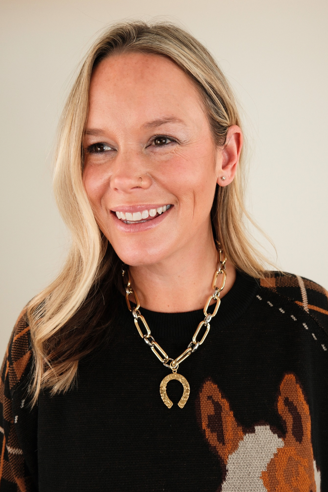 Western Luck Mixed Metal Necklace featuring silver and gold interlocking chain and horseshoe pendant — modern cowgirl statement jewelry.