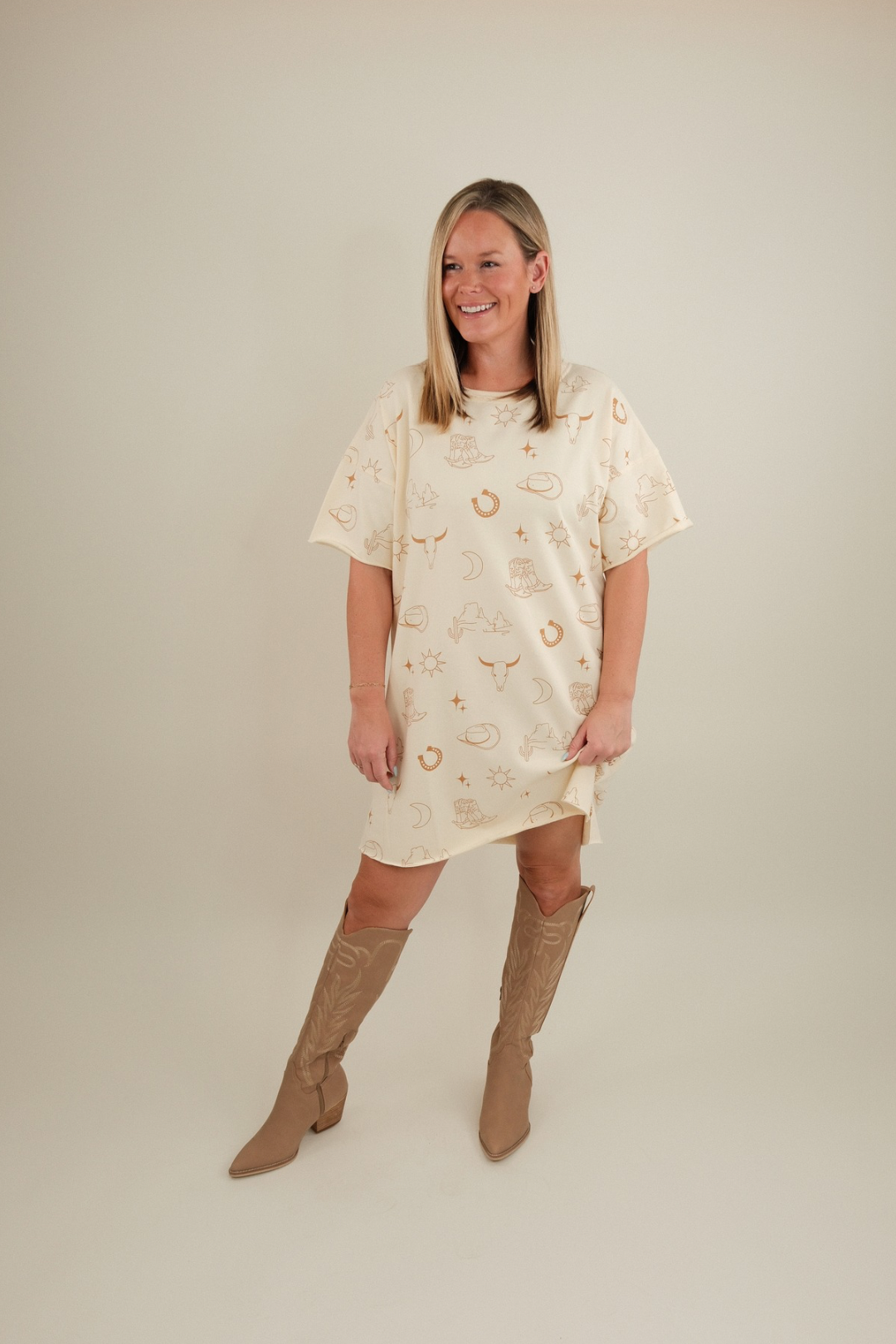 Cream Western Skies tee dress with short sleeves, relaxed fit, and subtle western vibe.