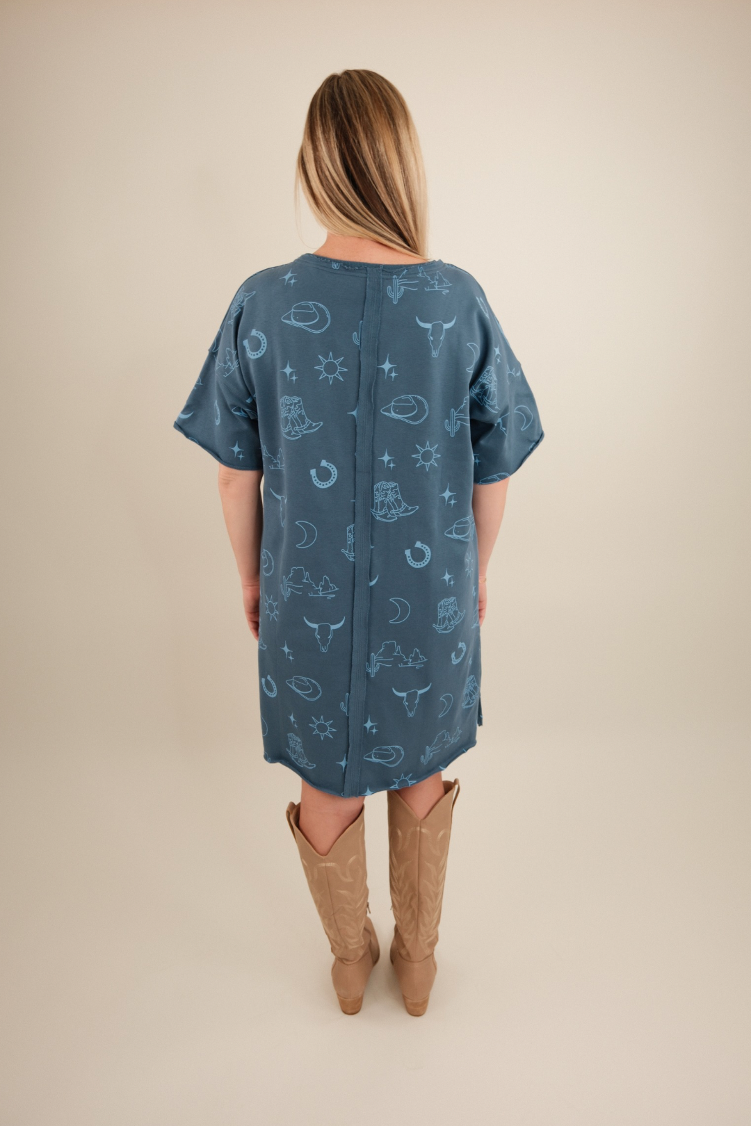 Back view of Western Skies Tee Dress, women’s dusty blue short sleeve cowgirl t-shirt dress with relaxed fit.