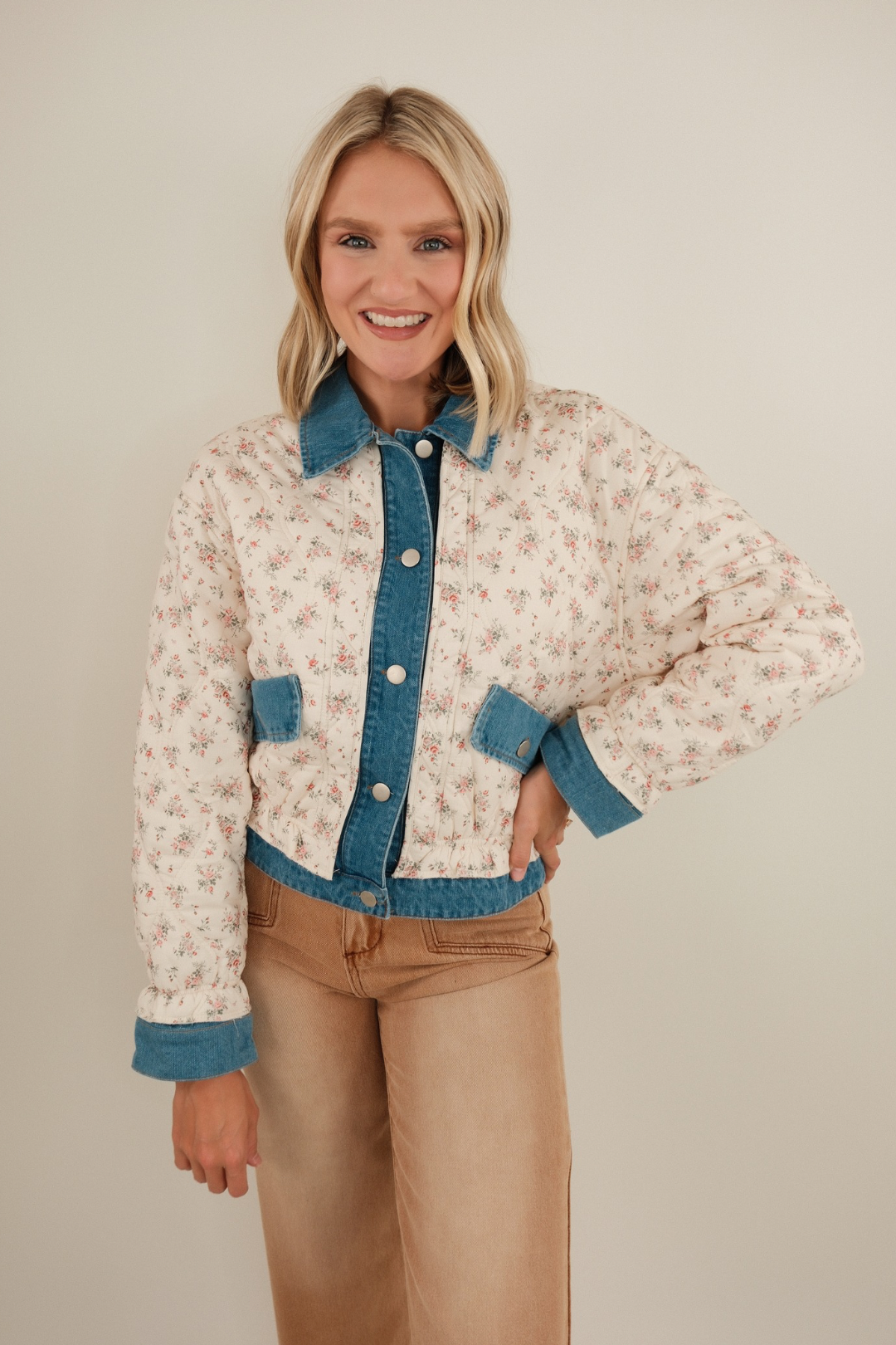 Quilted denim jacket with wildflower embroidery, medium wash, button-front western style.